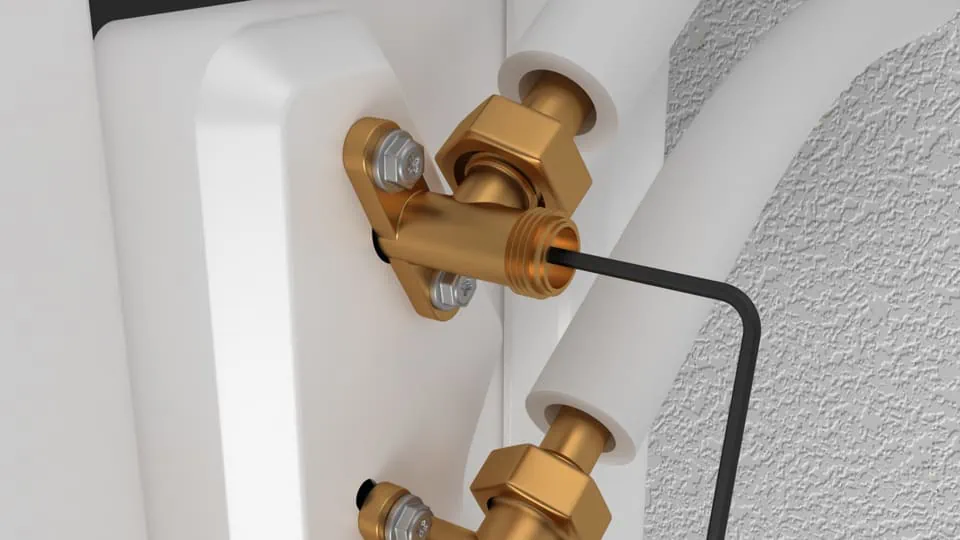 ALT: Hochwertige Heizungsarmatur mit goldfarbenen Anschlüssen und robustem Aufbau.